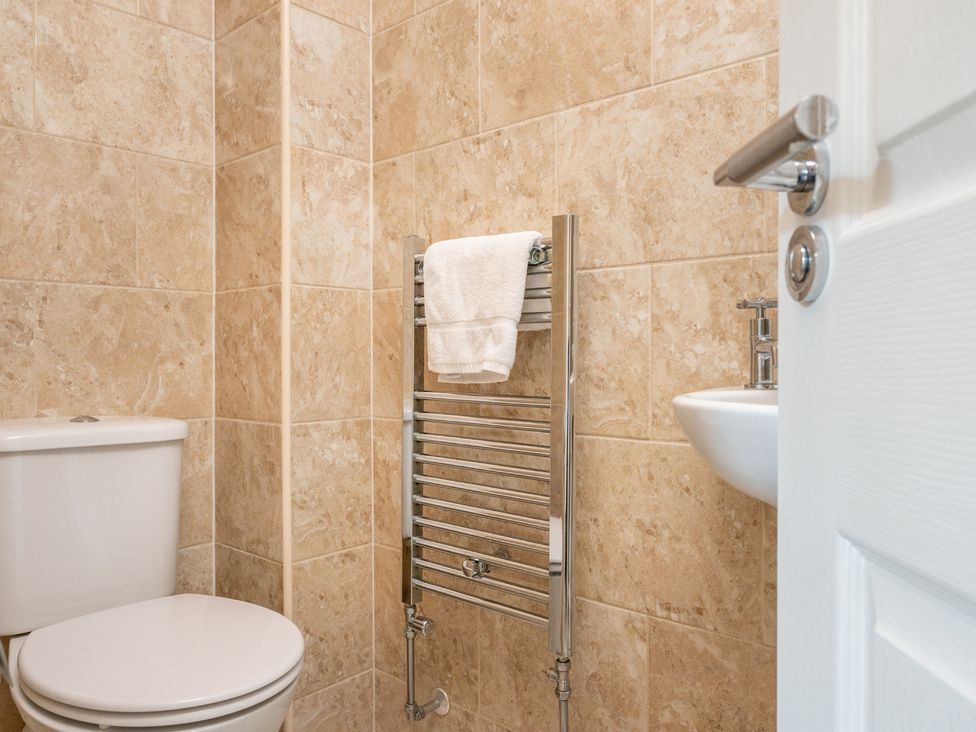 A bathroom with a toilet and hand basin at 127 Columbus Ravine Scarborough
