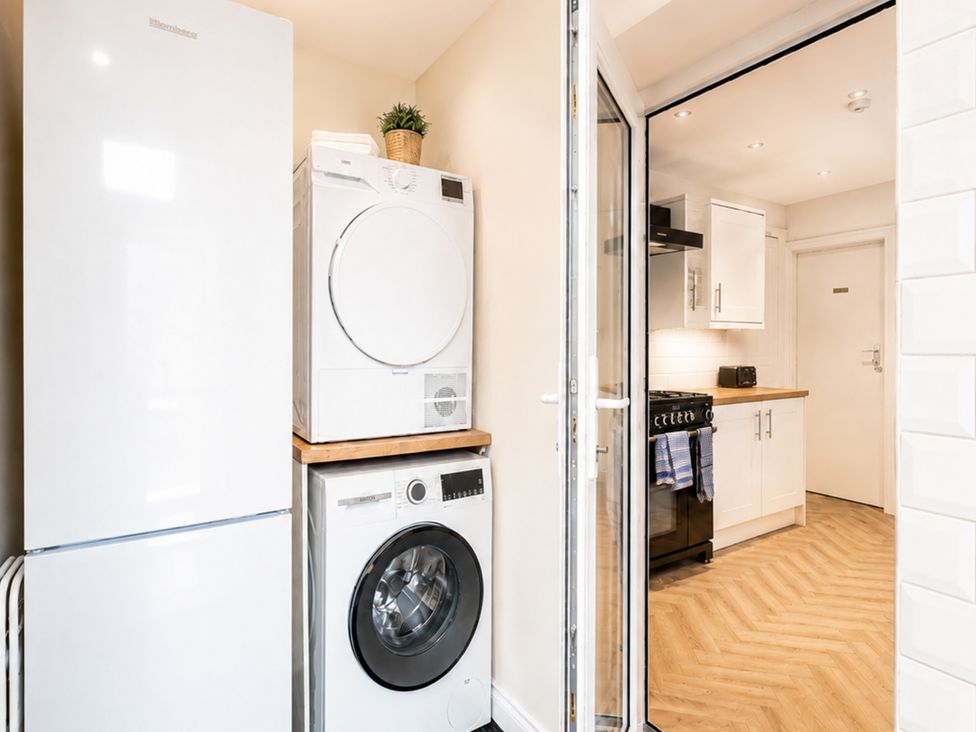 A laundry room with refrigerator, dryer and washing machine at 127 Columbus Ravine, Scarborough