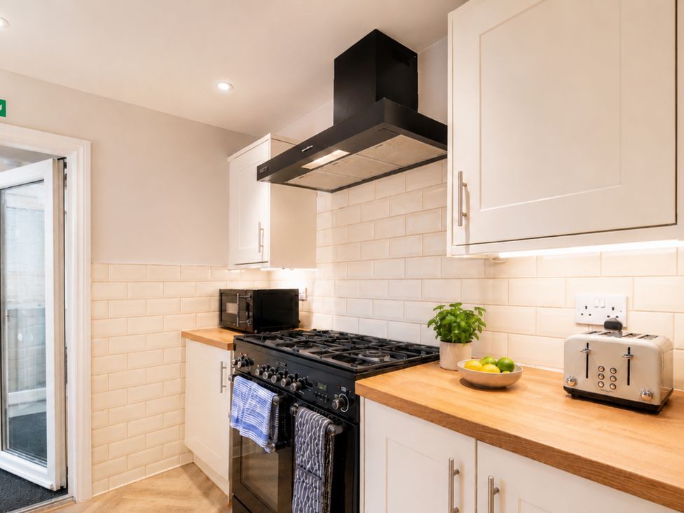 A kitchen with an oven, microwave, and toaster at 127 Columbus Ravine in Scarborough