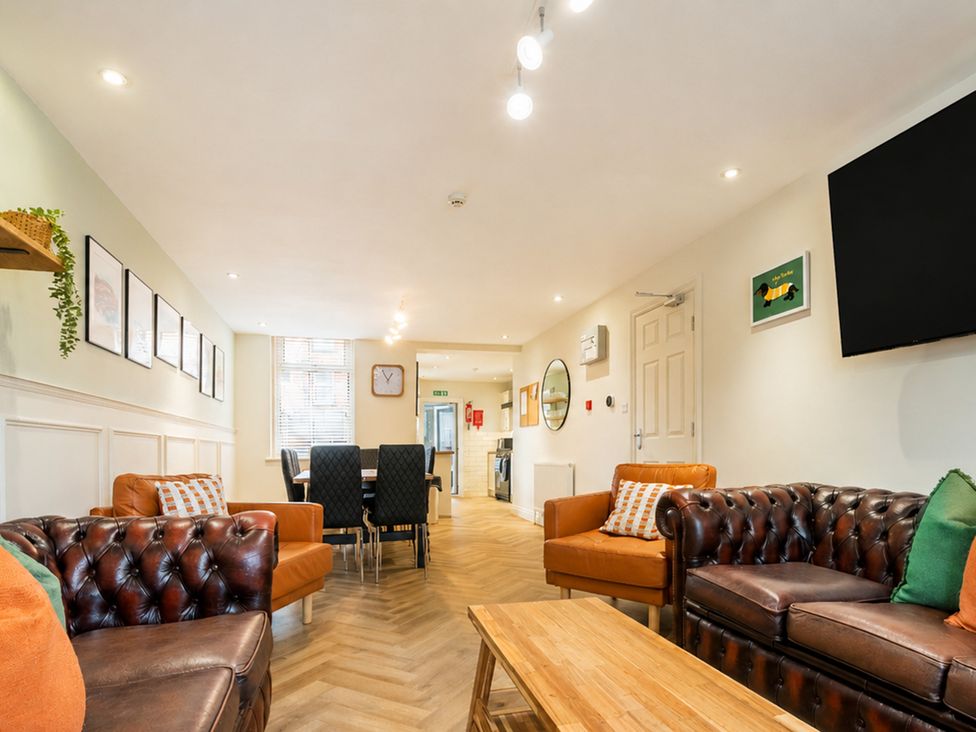 A living room with sofas and a table at 127 Columbus Ravine in Scarborough