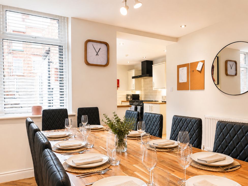 A dining room with a table set for meals at 127 Columbus Ravine, Scarborough