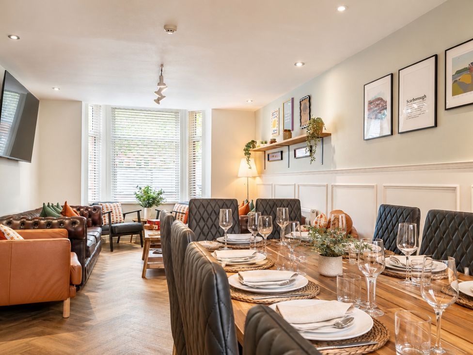 A dining room with a table set for guests at 127 Columbus Ravine Scarborough