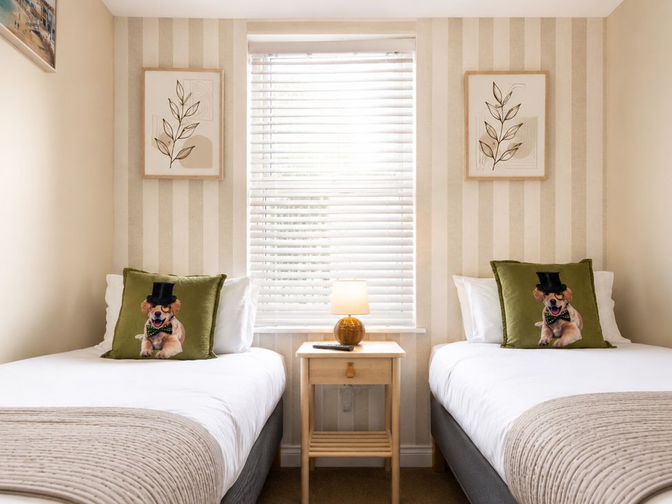 A bedroom with two beds and decorative pillows at 127 Columbus Ravine Scarborough