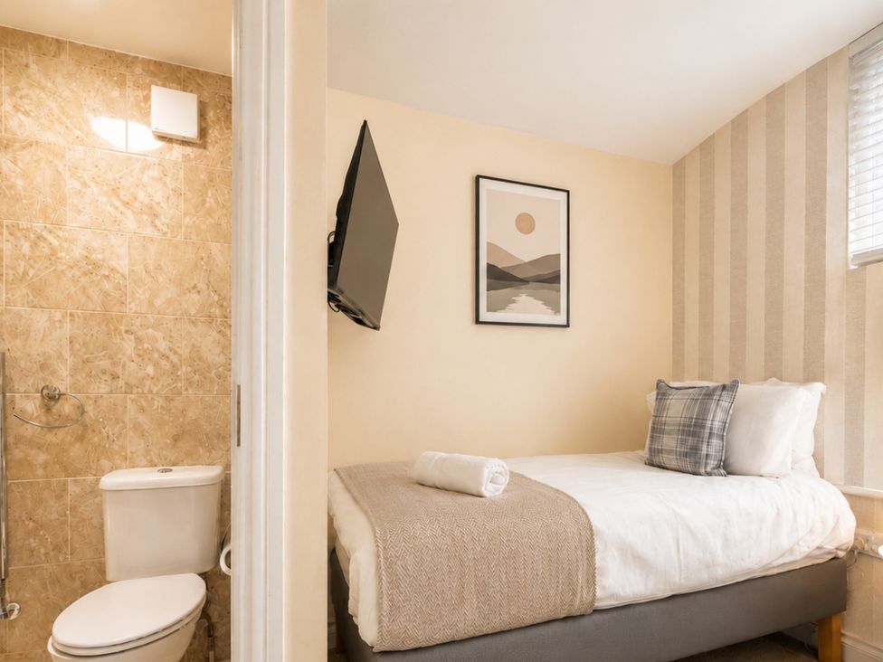 A bedroom with a single bed and a bathroom at 127 Columbus Ravine, Scarborough