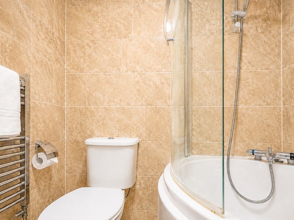 A bathroom with a shower and toilet at 127 Columbus Ravine in Scarborough