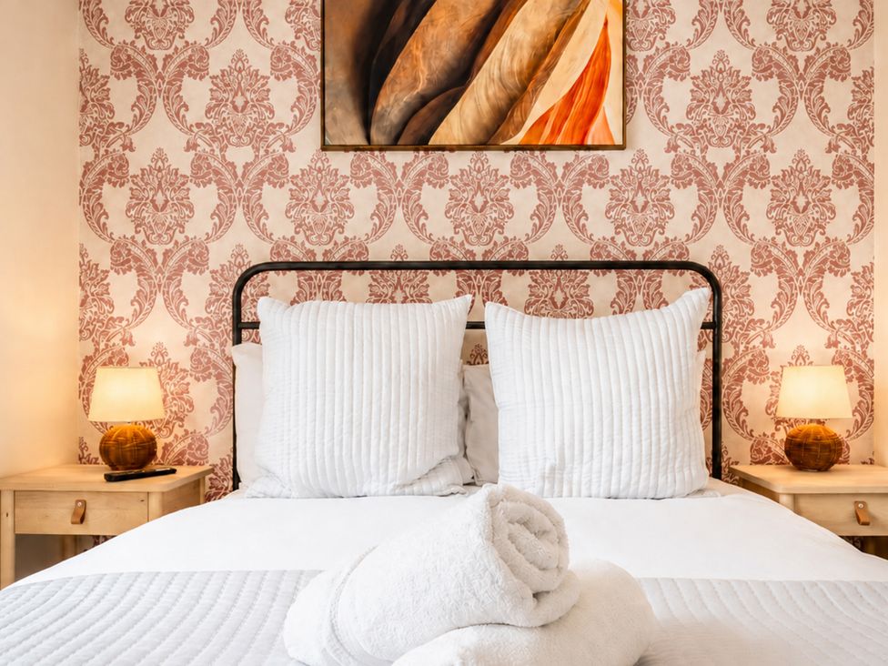 A bedroom with a bed and decorative pillows at 127 Columbus Ravine in Scarborough
