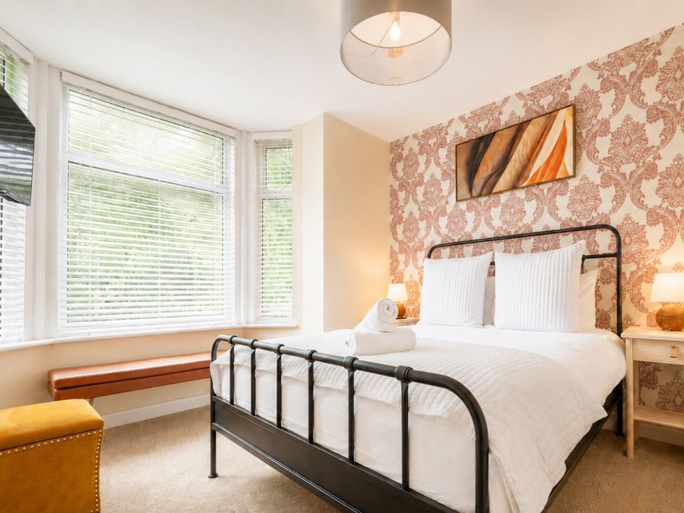 A bedroom with a bed and artwork on the wall at 127 Columbus Ravine Scarborough