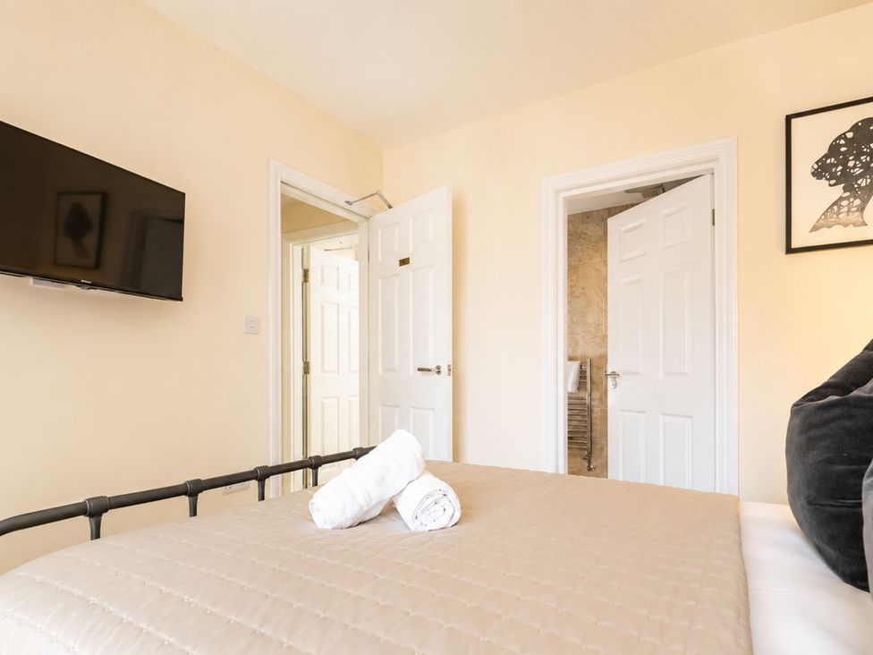 A bedroom with a bed and television at 127 Columbus Ravine in Scarborough
