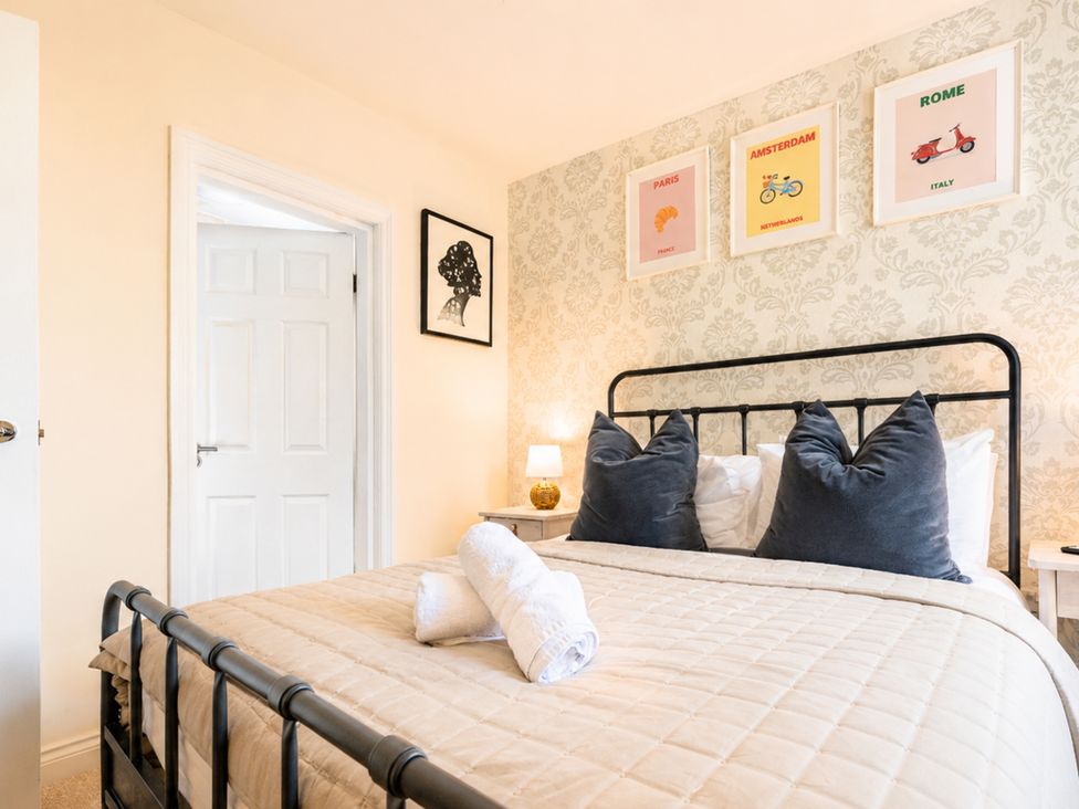 A bedroom with a bed and artwork at 127 Columbus Ravine Scarborough