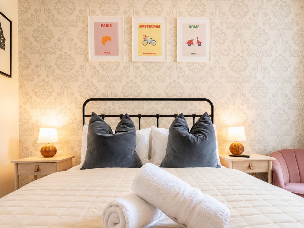 A bedroom with a bed and art on the wall at 127 Columbus Ravine, Scarborough