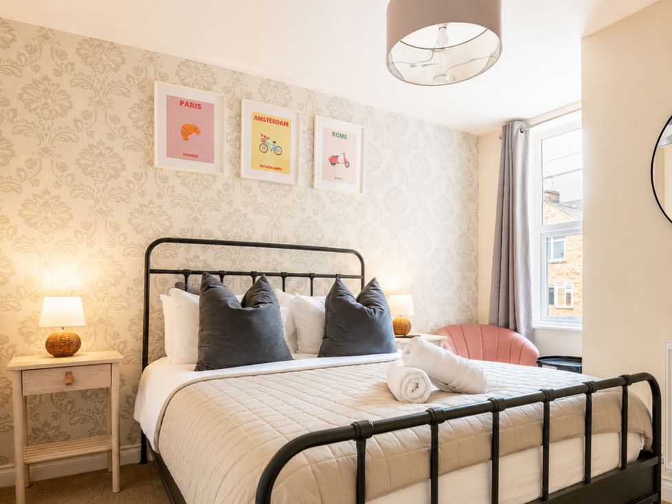 A bedroom with a bed and decorative posters at 127 Columbus Ravine in Scarborough