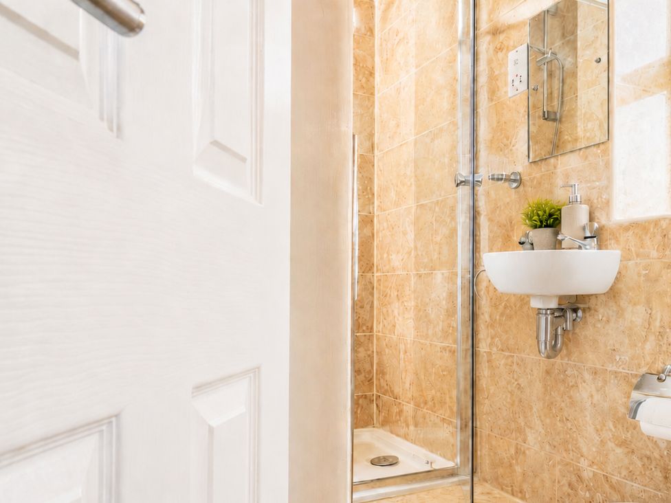 A bathroom with a shower and sink at 127 Columbus Ravine in Scarborough
