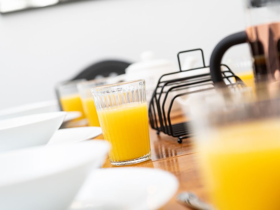 A table set with juice glasses and bowls at 23 Trafalgar Road, Scarborough