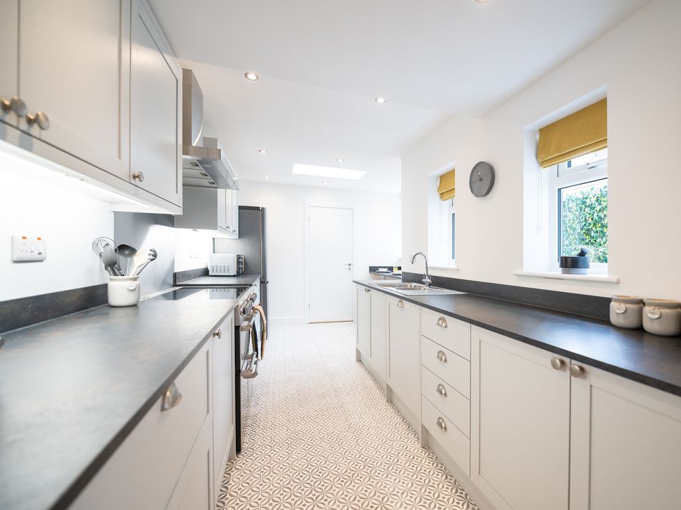 A kitchen with cabinets and appliances at 23 Trafalgar Road Scarborough