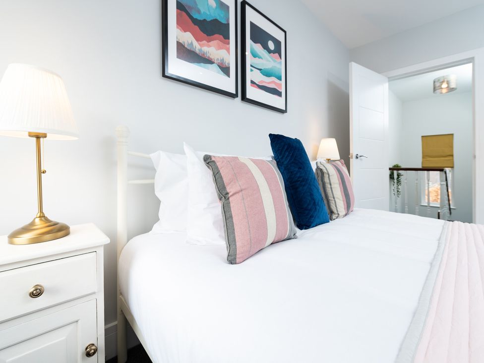 A bedroom with a bed and lamp at 23 Trafalgar Road in Scarborough