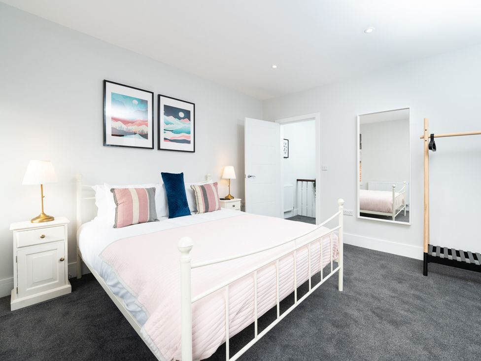 A bedroom with a bed and lamp at 23 Trafalgar Road in Scarborough