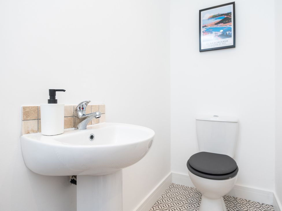 A bathroom with a sink and toilet at 23 Trafalgar Road in Scarborough