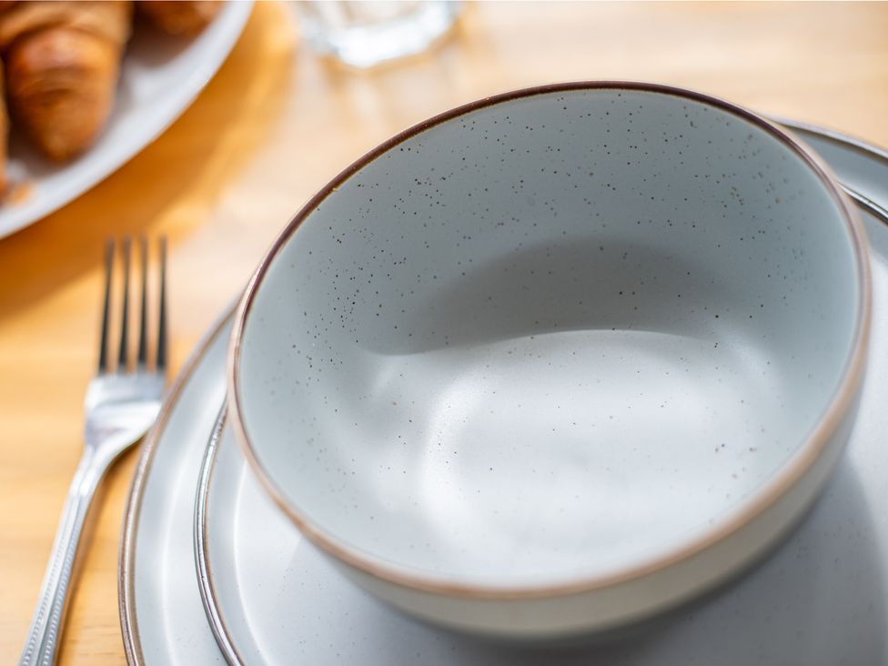 A bowl and plate with a fork and croissants at 53A Hampton Road Scarborough