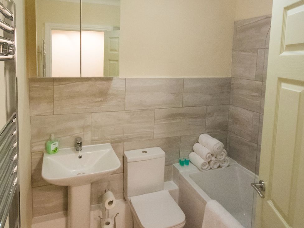 A bathroom with a sink, toilet, and bathtub at 53 Hampton Road Scarborough