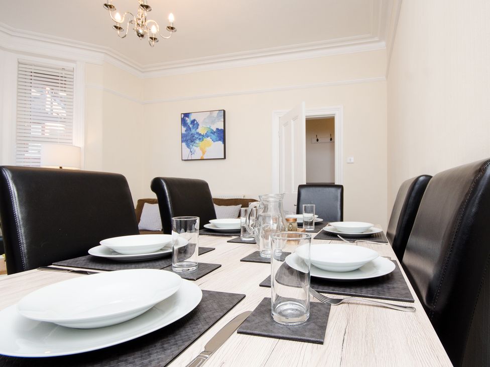 A dining room with a set table at 46 Ashville Avenue Scarborough