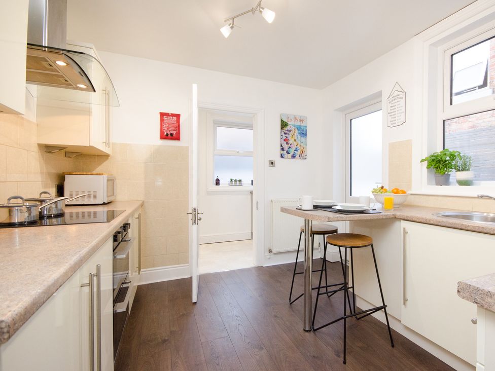 A kitchen with a stove and countertop at 46 Ashville Avenue, Scarborough