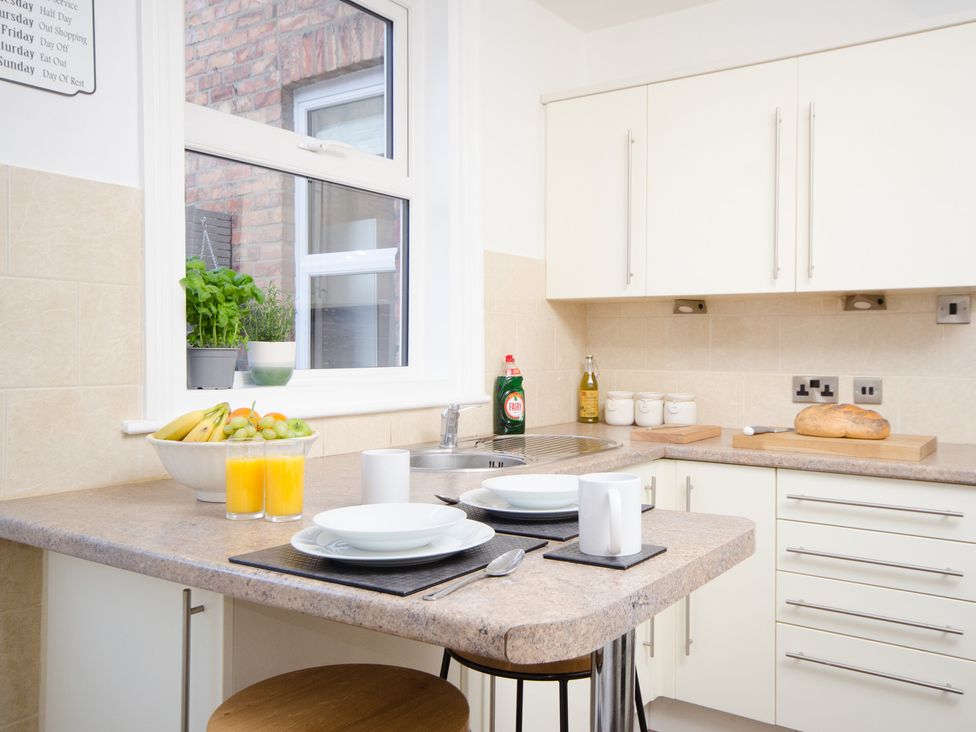 A kitchen with a sink and fruit bowl at 46 Ashville Avenue Scarborough
