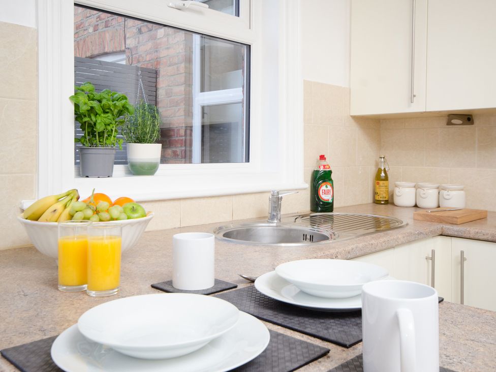 A kitchen with a sink, fruit bowl, and drinkware at 46 Ashville Avenue Scarborough