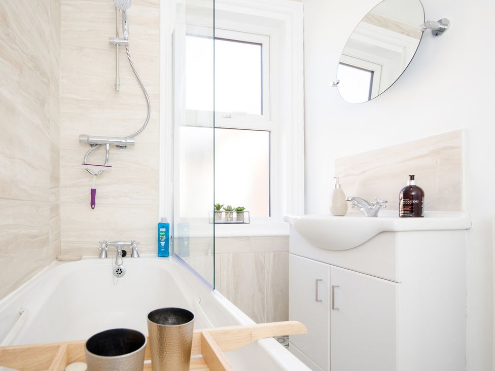 A bathroom with bathtub and sink at 46 Ashville Avenue Scarborough