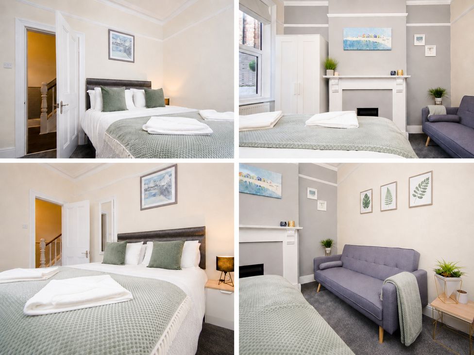 A bedroom with a bed and sofa at 46 Ashville Avenue in Scarborough