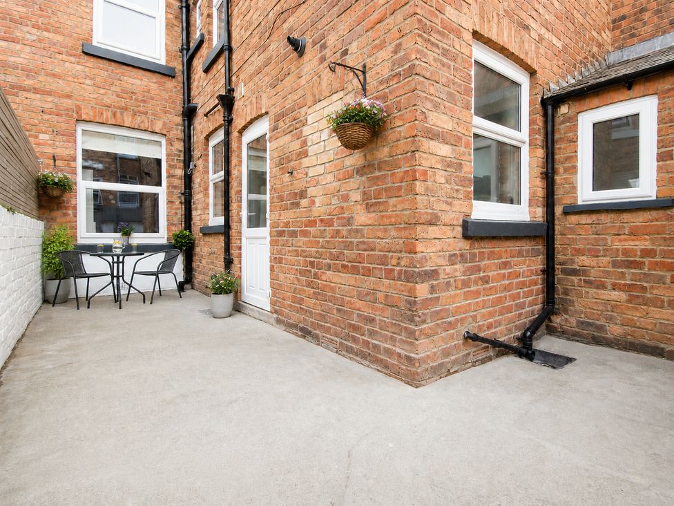 An outdoor area with a small table and chairs at 46 Ashville Avenue Scarborough