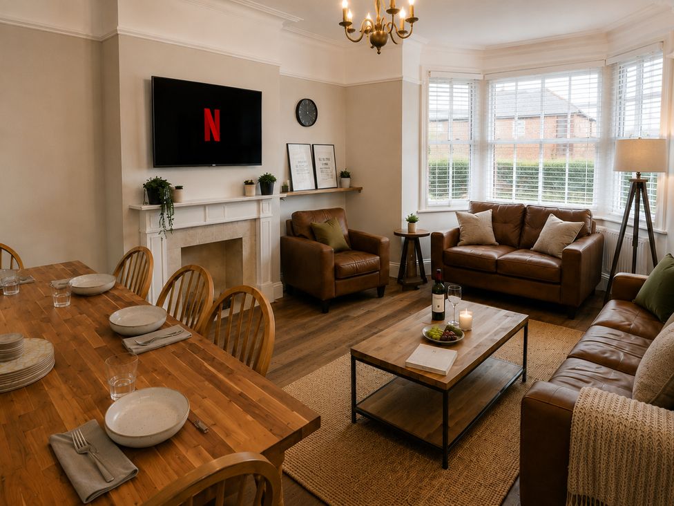 A living room with a television and seating area at 46 Ashville Avenue Scarborough