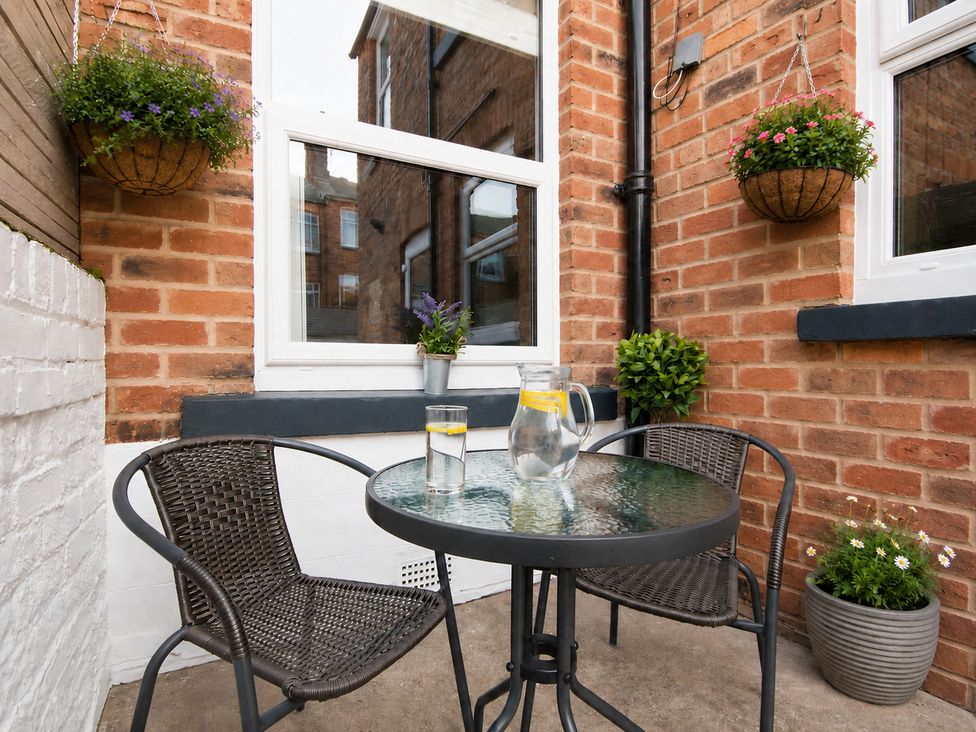 An outdoor seating area with a table and chairs at 46 Ashville Avenue in Scarborough