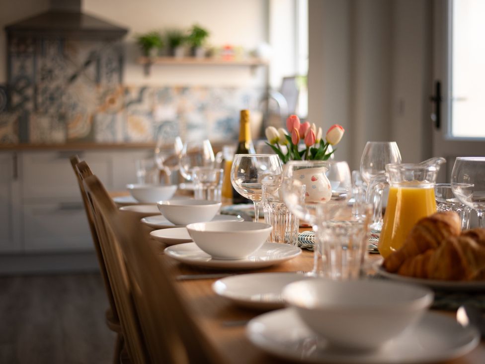 A dining table set with bowls and glasses at 22 Ashville Avenue in Scarborough