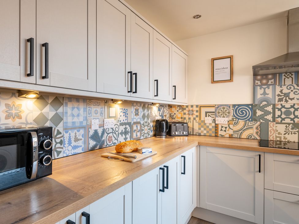 A kitchen with countertops and appliances at 22 Ashville Avenue in Scarborough