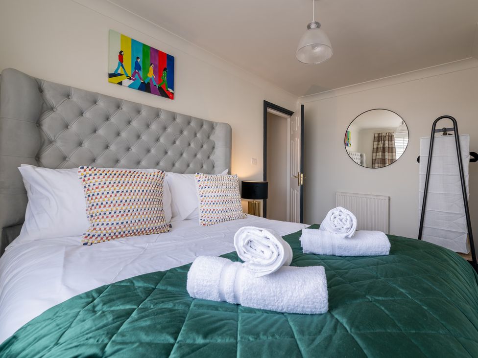 A bedroom with a bed and pillows at 22 Ashville Avenue Scarborough