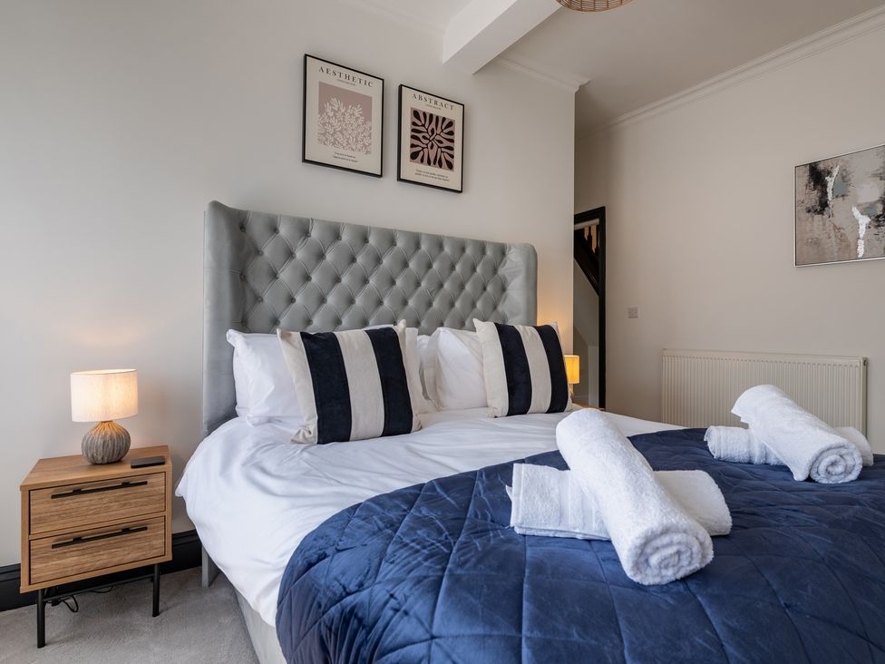 A bedroom with a bed and bedside table at 22 Ashville Avenue in Scarborough