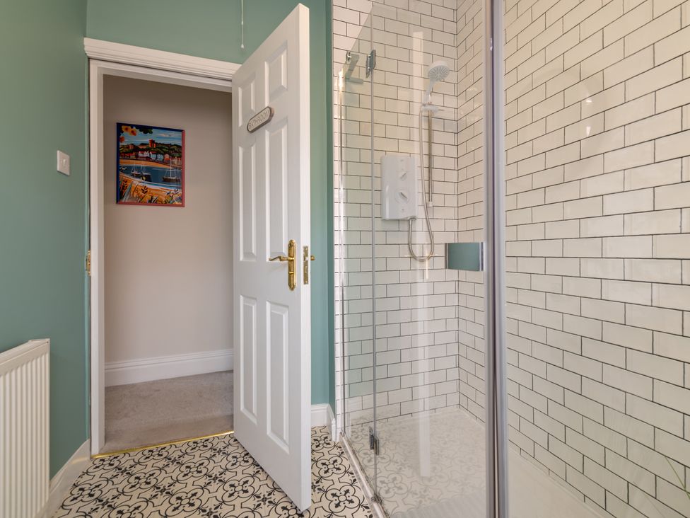 A bathroom with a shower and wall art at 22 Ashville Avenue Scarborough