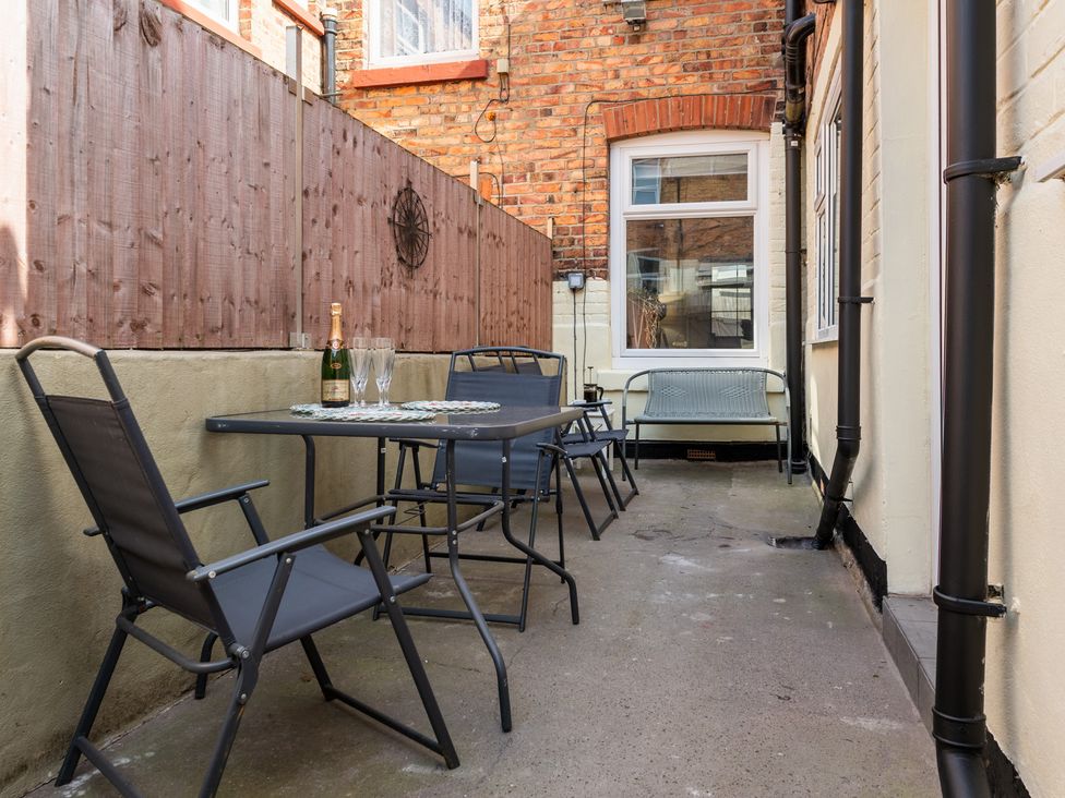 An outdoor area with a table and chairs at 22 Ashville Avenue Scarborough