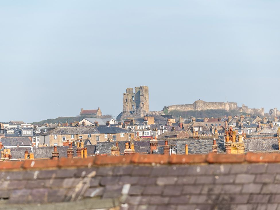 A view of rooftops and a castle in the background at 22 Ashville Avenue, Scarborough