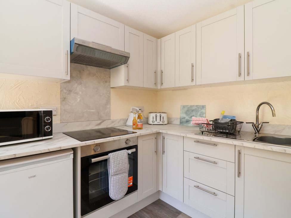 A kitchen with appliances and utensils at Chestnut in Weston-super-Mare