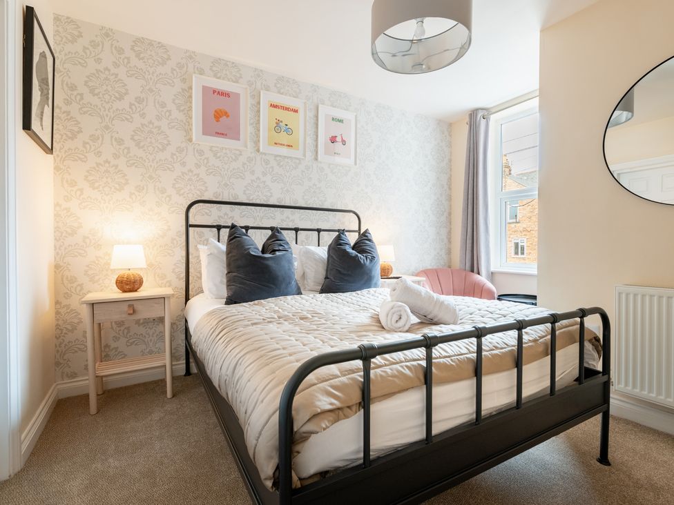 A bedroom with a bed and nightstand at The Ravines in Scarborough