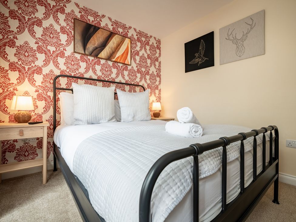 A bedroom with a bed and bedside table at The Ravines in Scarborough