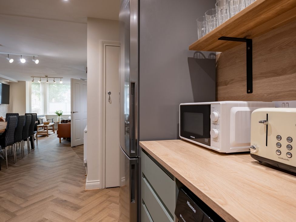 A kitchen with a refrigerator and appliances at The Ravines in Scarborough