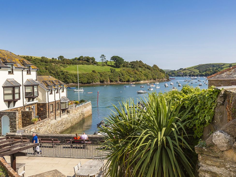 A view of boats on the water with houses and trees at Primrose Cottage Salcombe