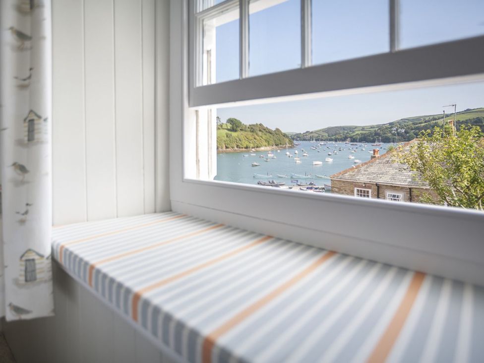 A window overlooking a sea view at Primrose Cottage in Salcombe