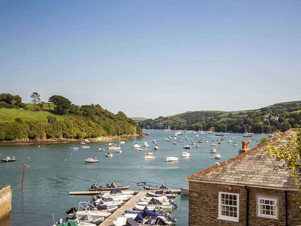 A view of boats on water with hills in the background at Primrose Cottage Salcombe