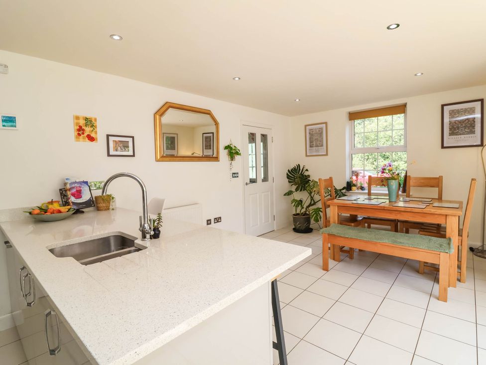 A kitchen with a dining area and table at Manning's View in Barnstaple