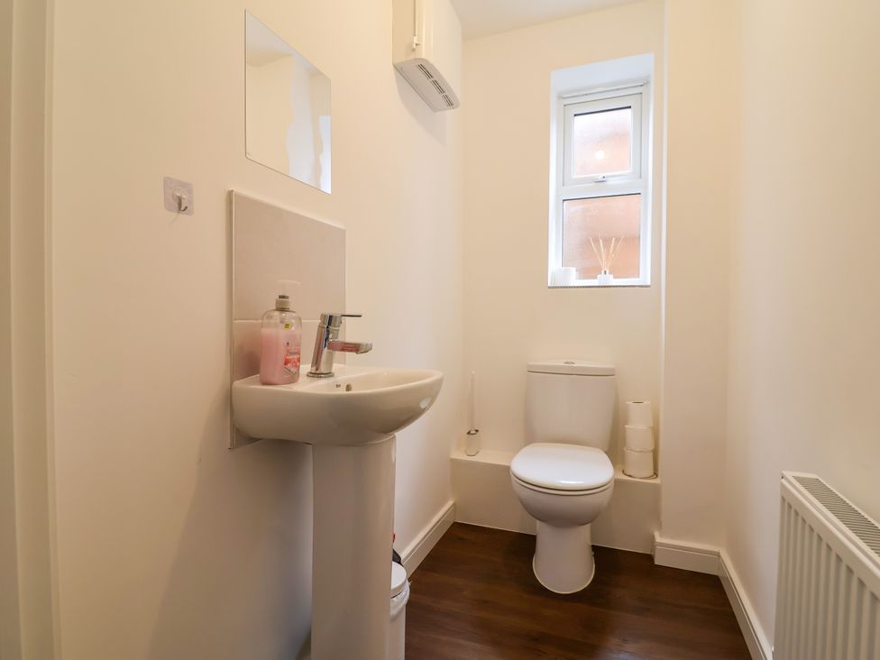 A bathroom with a sink and toilet at 12 Corbetts Close Crewe