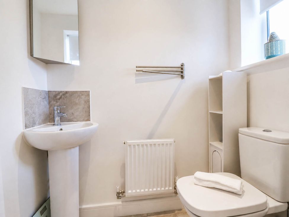 A bathroom with a sink and toilet at Serenity House