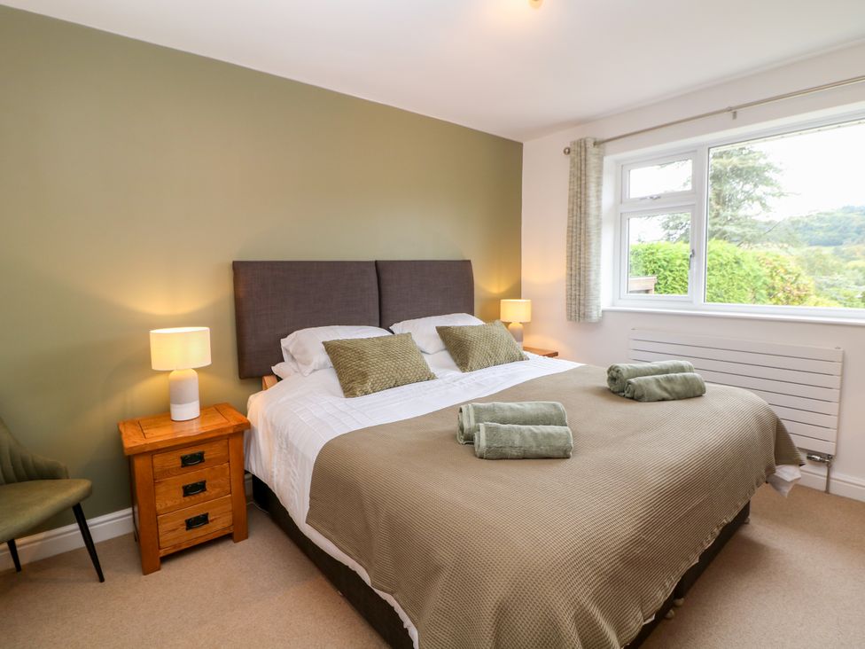 A bedroom with a bed and nightstand at Hillset View in Bakewell